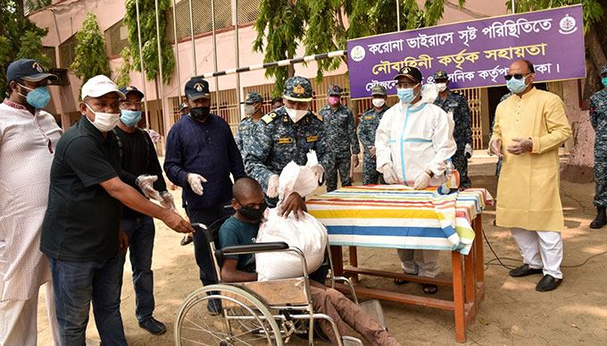Bangladesh Navy distributing relief to helpless and distressed people to ensure home quarantine to prevent COVID-19