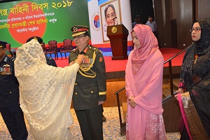 Hon’ble Prime Minister is awarding peacetime medal to a award holder from Bangladesh Army​​​​​